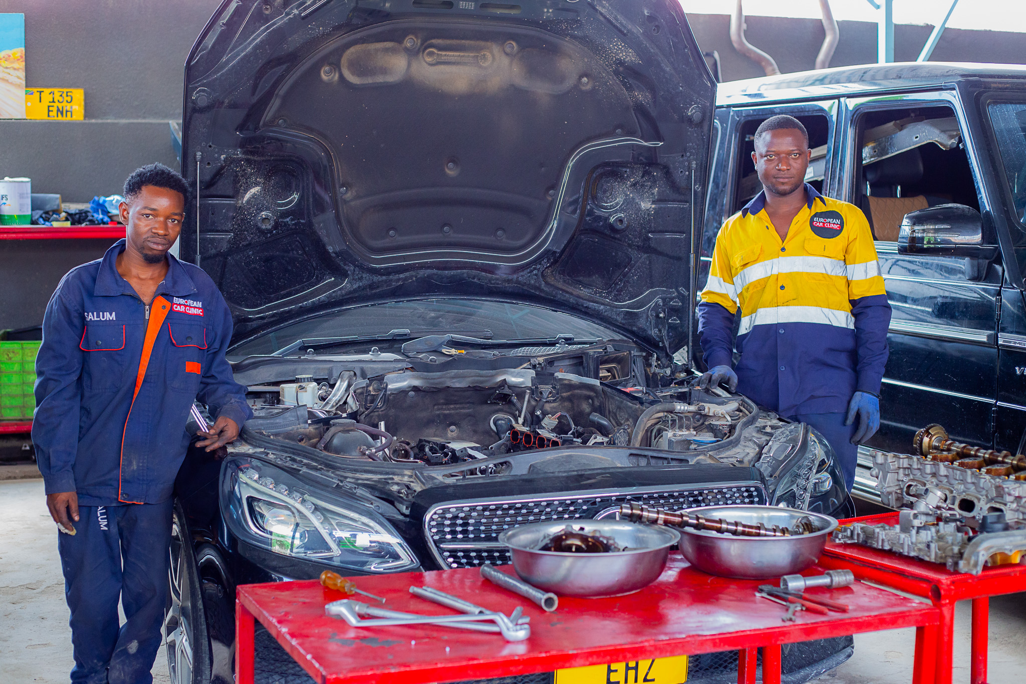 European Car Clinic technicians with a premium vehicle