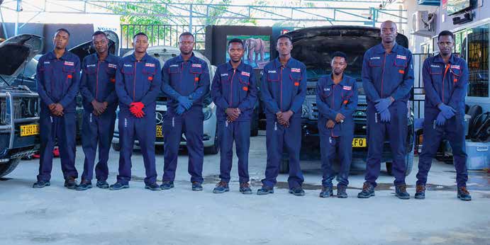 European Car Clinic team standing in the workshop